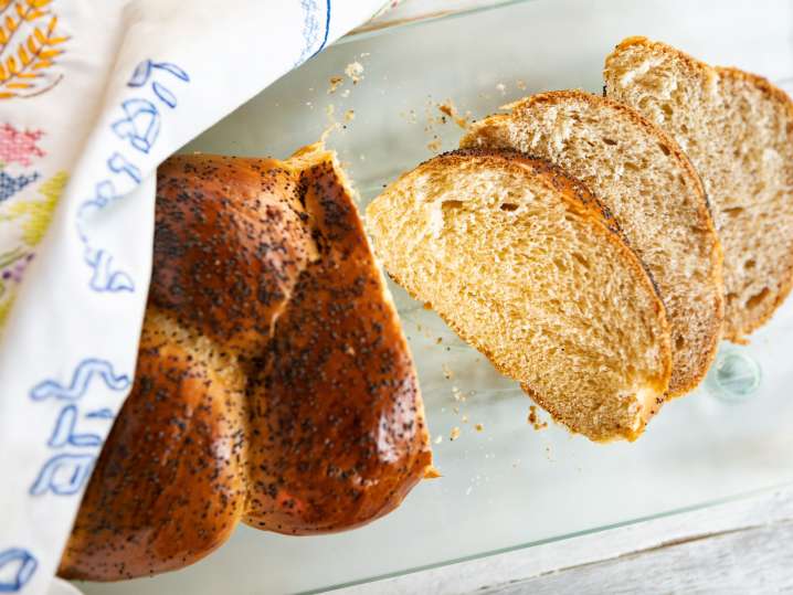 loaf of brioche bread being sliced Shot