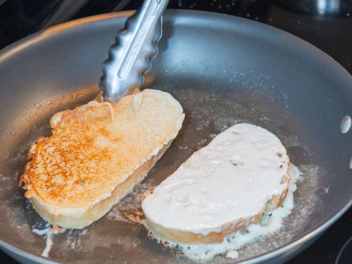 brioche slices in a frying pan for french toast Shot