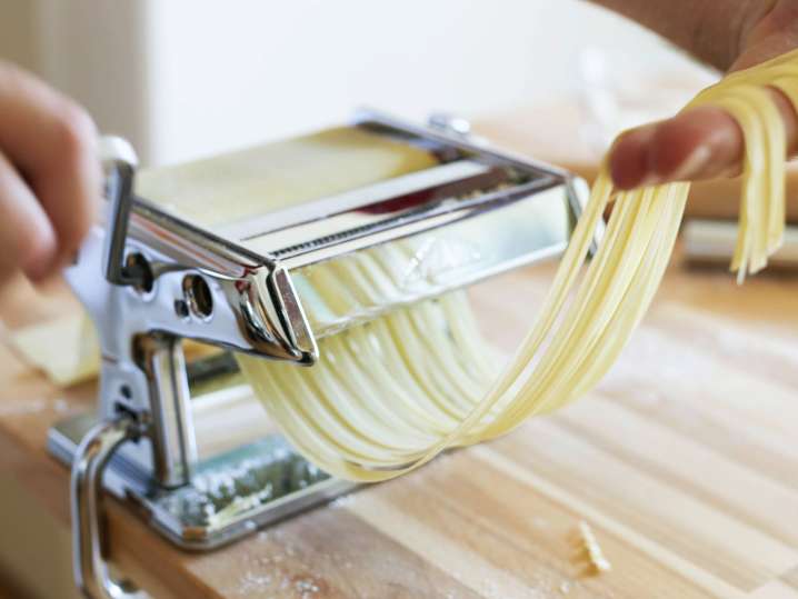 chef cutting fresh pasta Shot