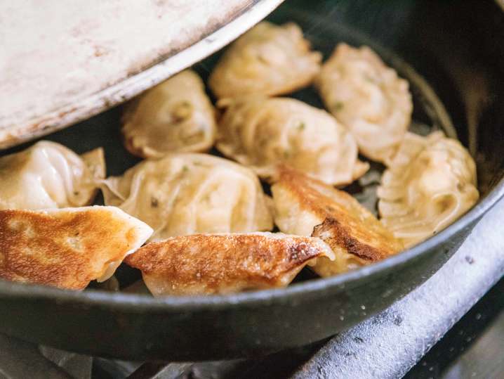 potstickers frying in a skillet Shot