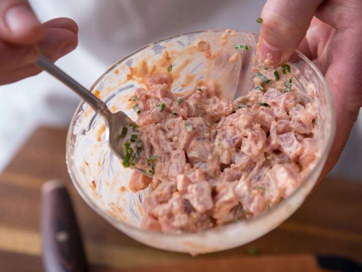 San Francisco - chef mixing spicy tuna for sushi rolls Shot