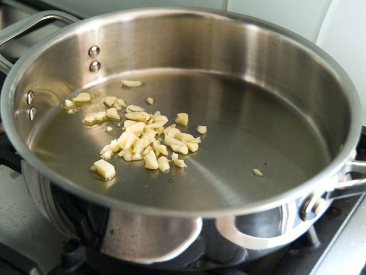 Los Angeles - chef cooking garlic in a pan Shot