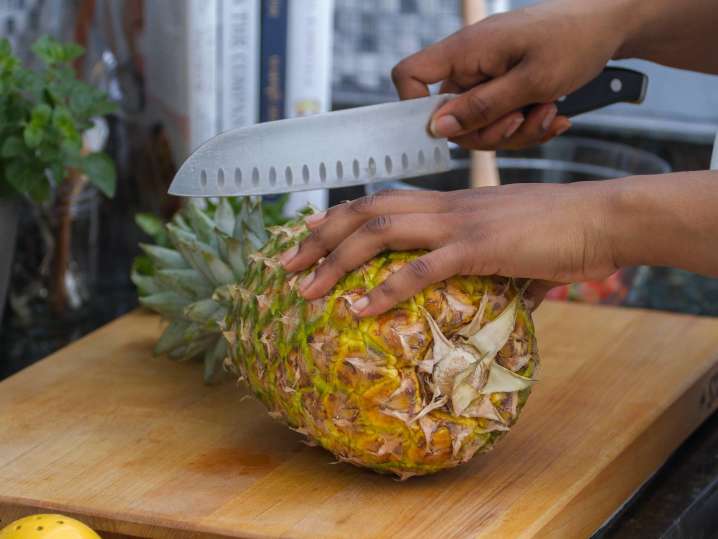 chef slicing a pineapple | Classpop Shot