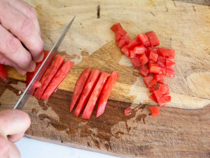 person dicing tomatoes for pico de gallo | Classpop Shot