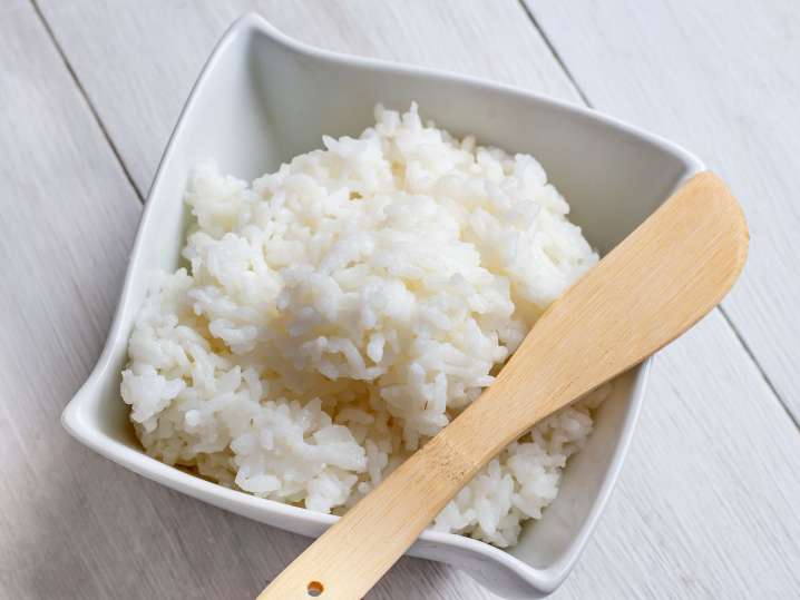 sushi rice with wooden spoon Shot