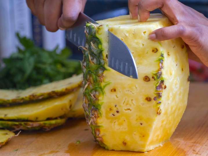 chef slicing a pineapple | Classpop Shot