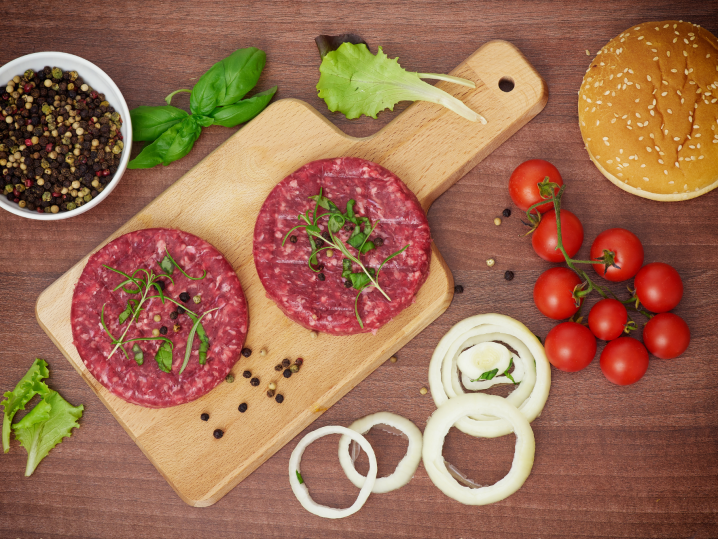 raw burgers with seasonings Shot