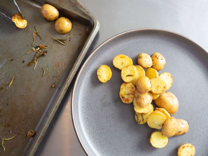 Chef plating roasted herb potatoes | Classpop Shot