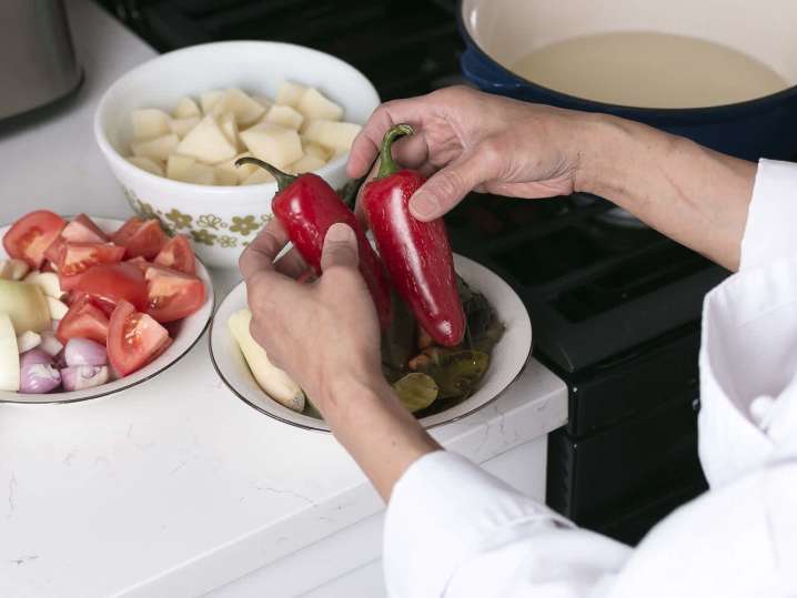 chef holding piquillo peppers | Classpop Shot