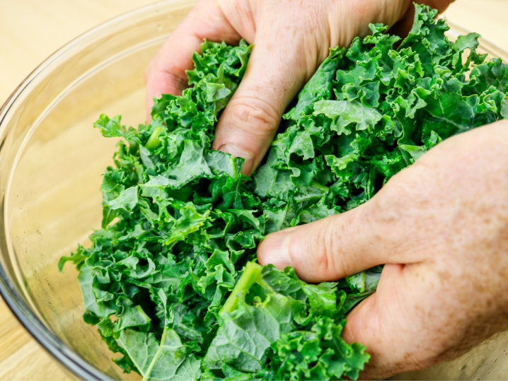 Chef massaging fresh kale | Classpop Shot