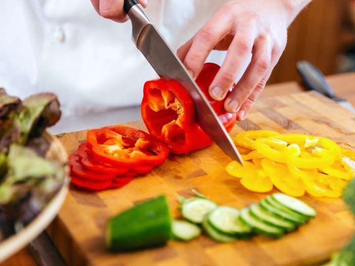 chef slicing red bell peppers | Classpop Shot