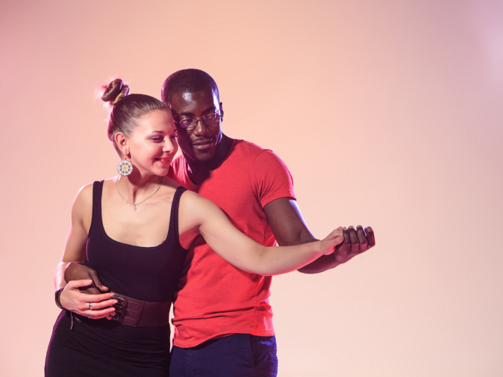 Denver - couple salsa dancing with pink background Shot