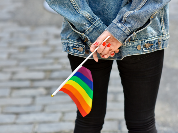 Minneapolis - holding small pride flag Shot