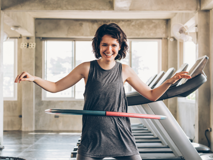 Nashville - woman hula hoopinh in gym Shot