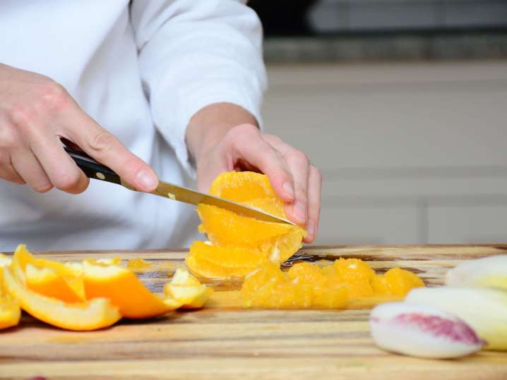 Chef slicing into an orange | Classpop Shot