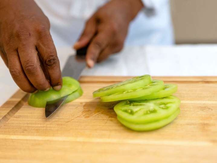 chef slicing green tomatoes | Classpop Shot