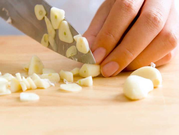 chef slicing garlic | Classpop Shot