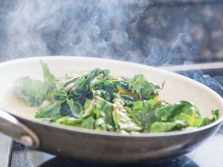 chef cooking greens in a pan | Classpop Shot