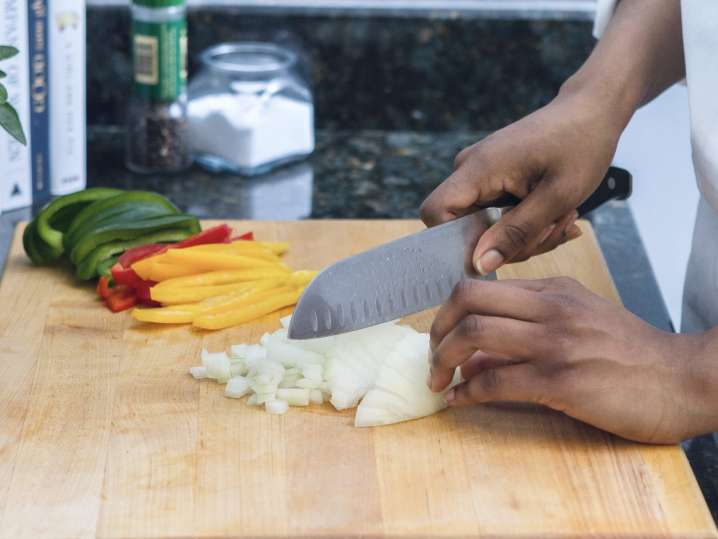 chef slicing onions and bell peppers | Classpop Shot