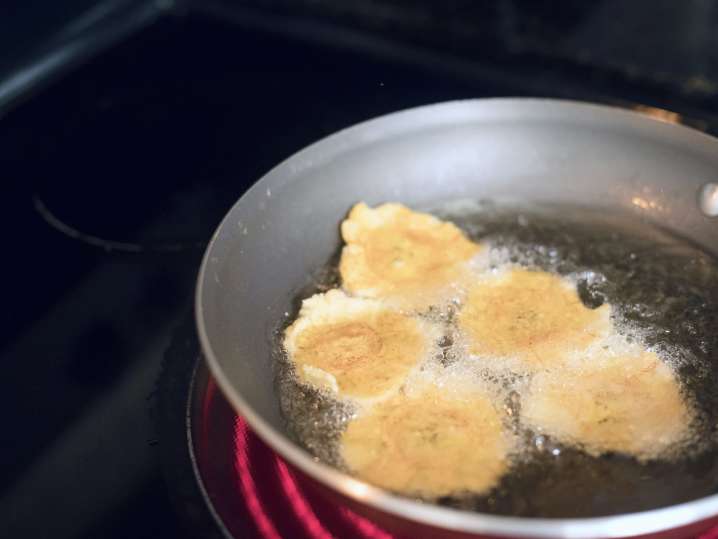 tostones being deep fried in a pan | Classpop Shot