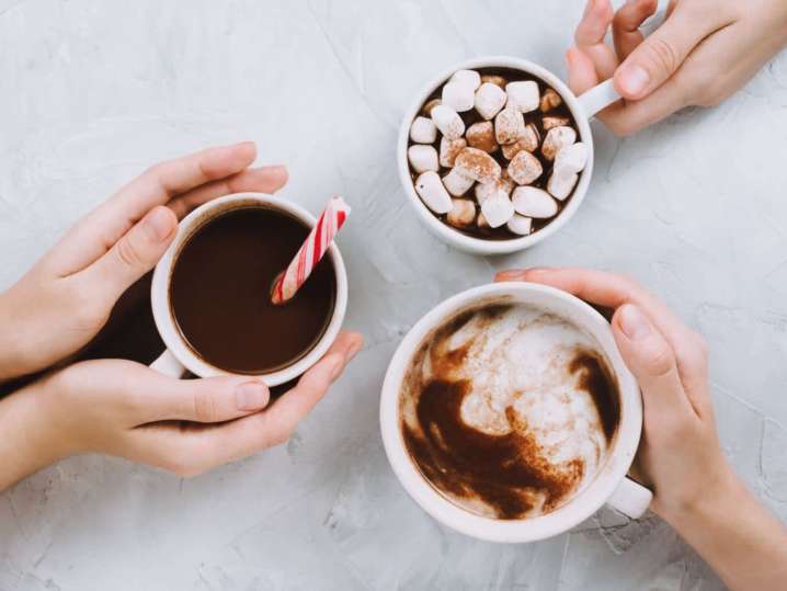 co workers enjoying hot cocoa at a team building event | Classpop Shot