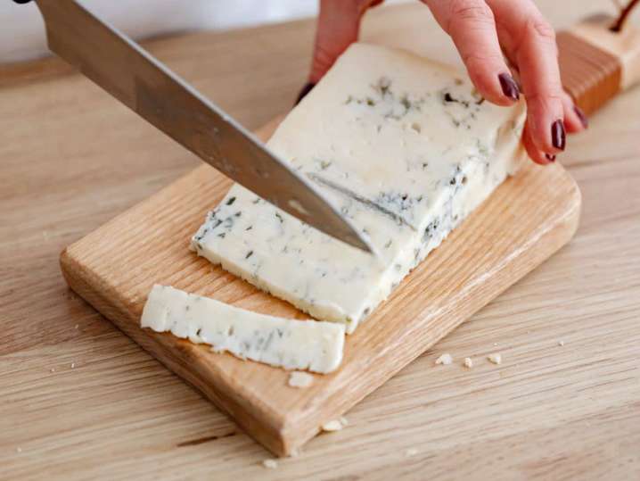 person slicing blue cheese | Classpop Shot