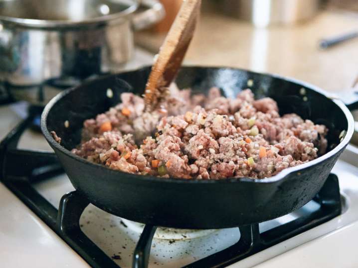 ground beef frying in a cast iron skillet | Classpop Shot