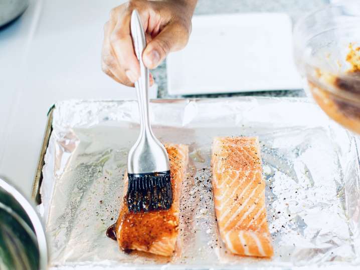 chef glazing salmon fillets | Classpop Shot