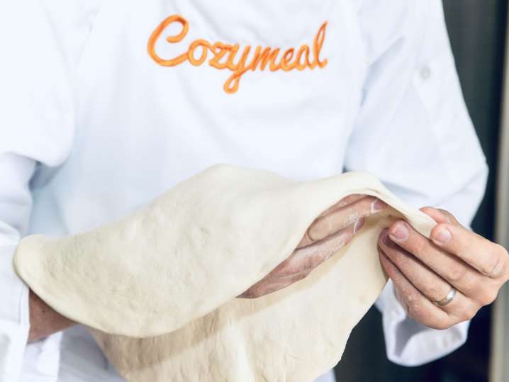 chef handling fresh pizza dough | Classpop Shot