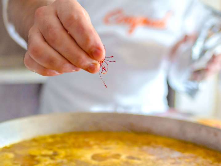 chef adding saffron to paella | Classpop Shot