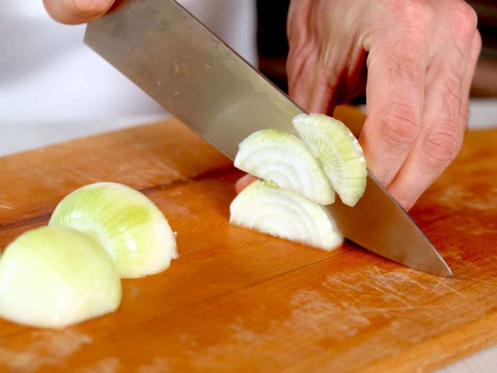 a chef slicing onions for french onion soup | Classpop Shot