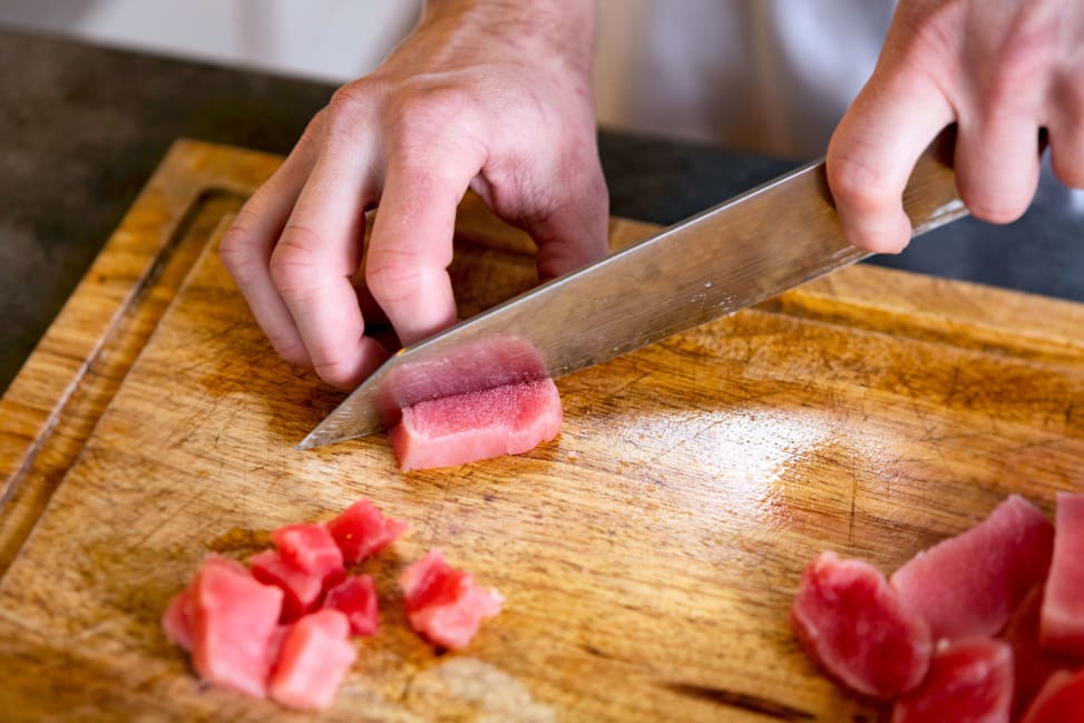 person slicing tuna for sushi rolls | Classpop Shot 3