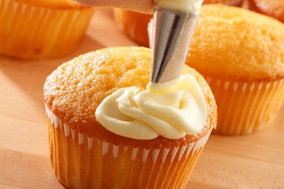 Sacramento - decorating a cupcake with vanilla filling Shot 4