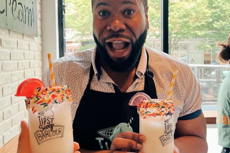 NYC - a man holding boozy sundae ice cream Shot 3