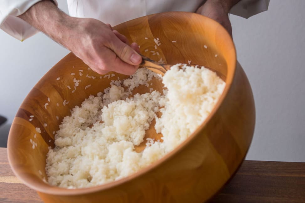 Los Angeles - Mixing sushi rice in a wooden bowl Shot 3