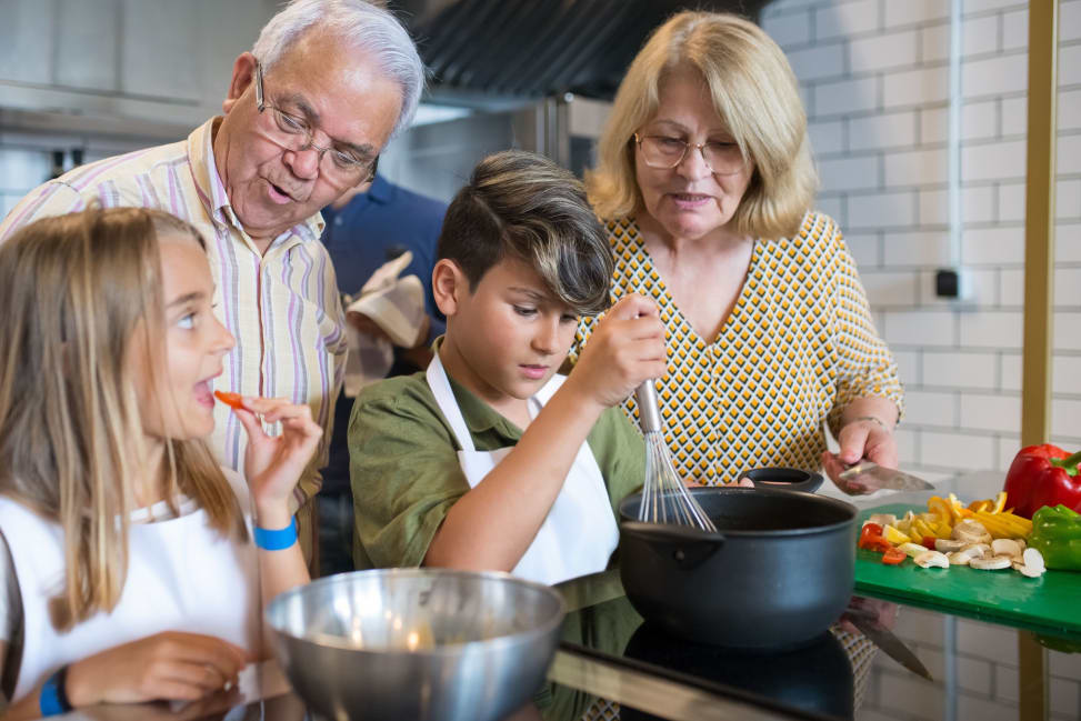 grandparents watching two siblings cook | Classpop Shot 2