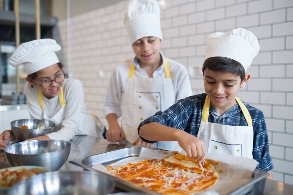 group of kids are preparing pizza for baking | Classpop Shot 4