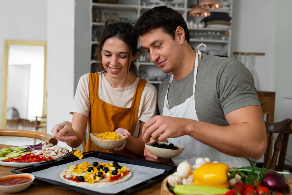 couple preparing fresh pizza with various toppings | Classpop Shot 2