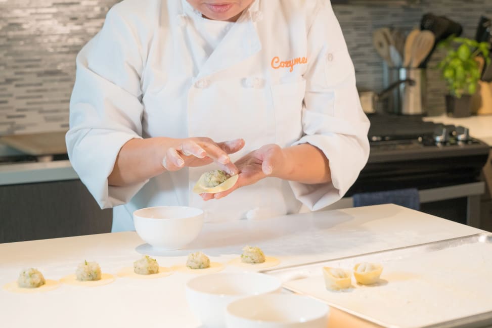 Chef folding dumplings at counter | Classpop Shot 3