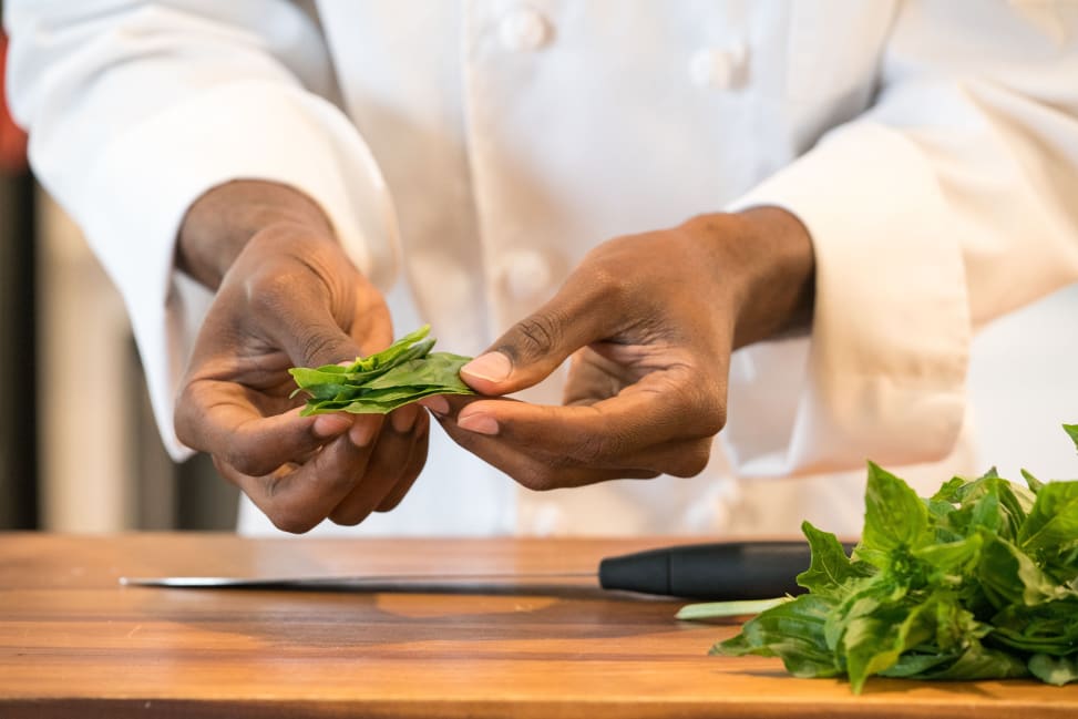 chef holding freshly picked basil leaves Shot 3