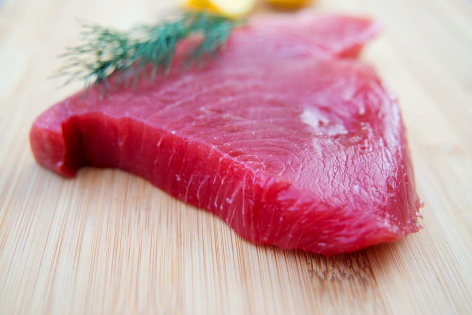 fresh tuna steak on a cutting board Shot 2