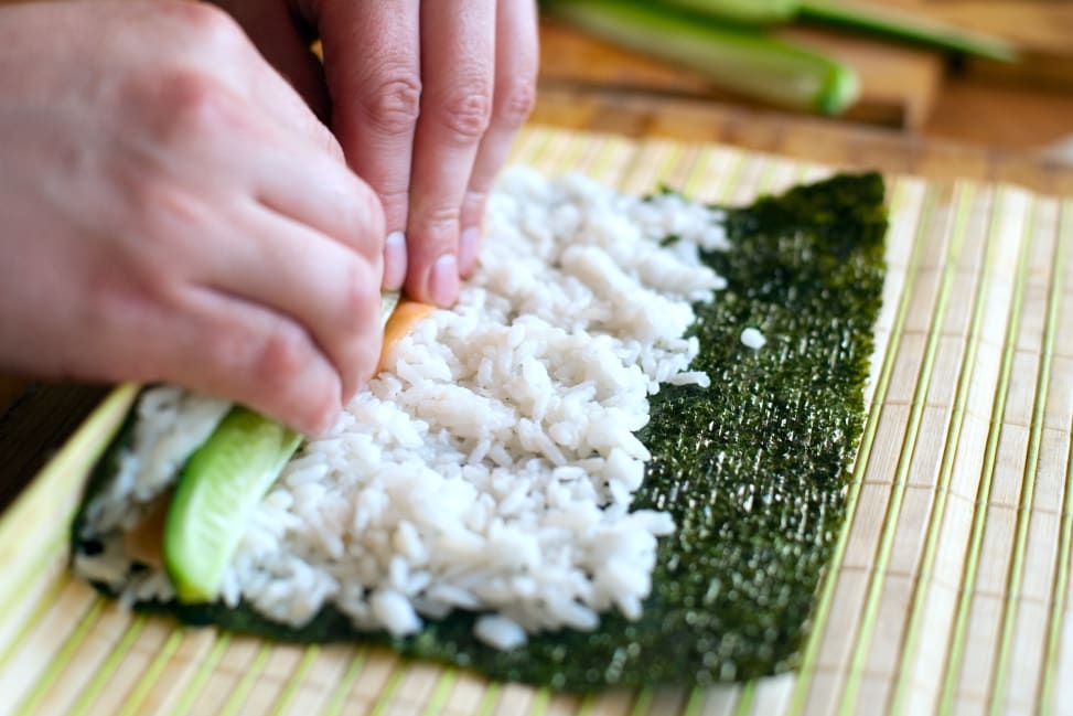 Miami - chef rolling cucumber kappa sushi roll Shot 2