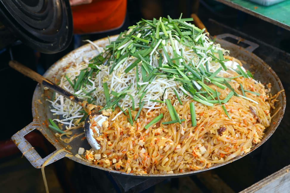 chef cooking pad thai in large skillet | Classpop Shot 3