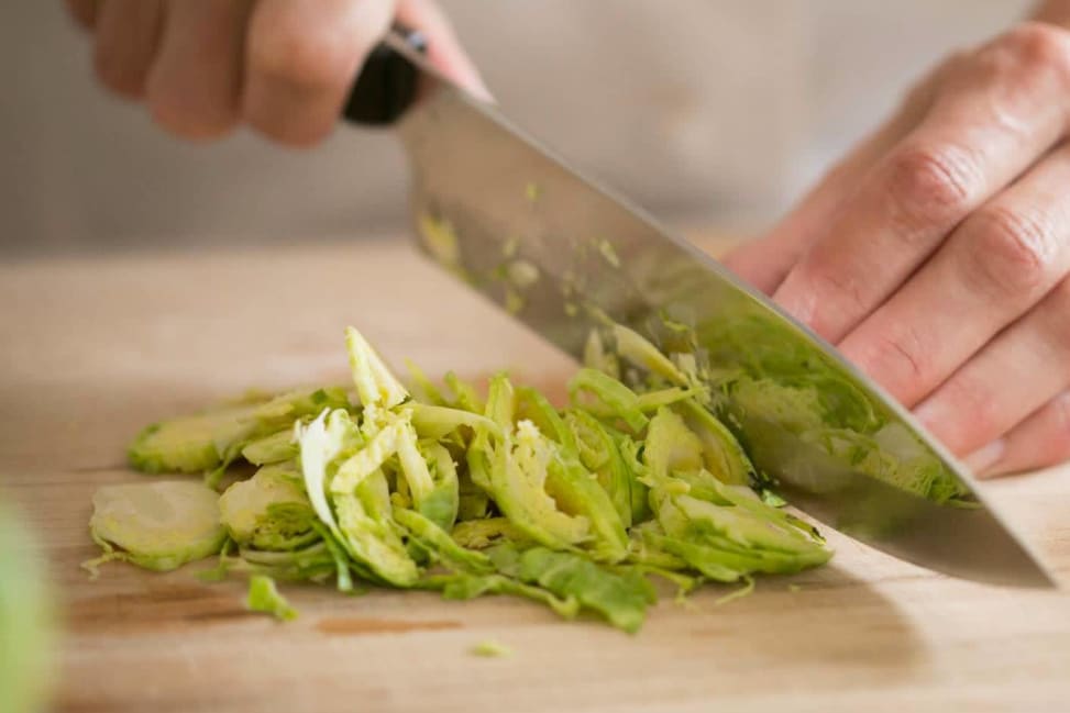 chef slicing brussels sprouts for a salad | Classpop Shot 4