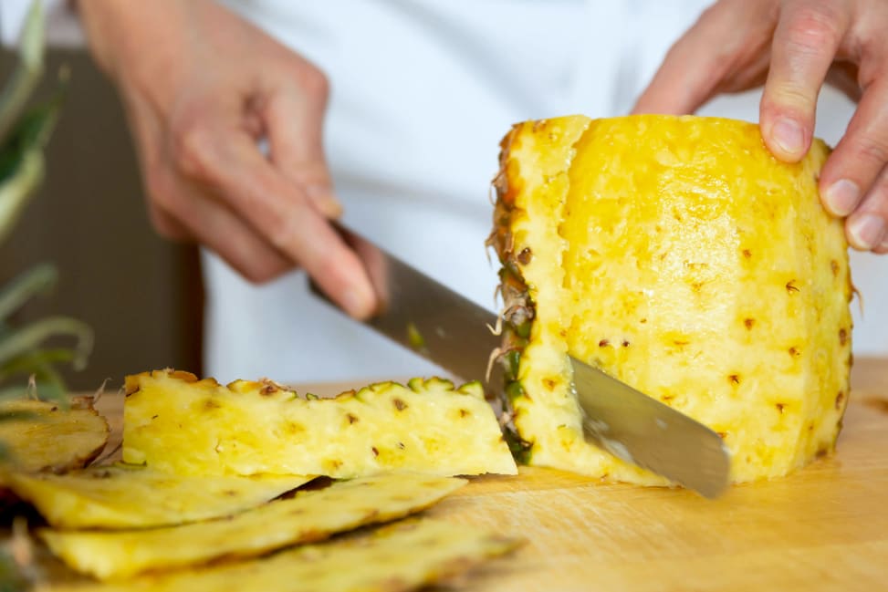 chef slicing fresh pineapple | Classpop Shot 2