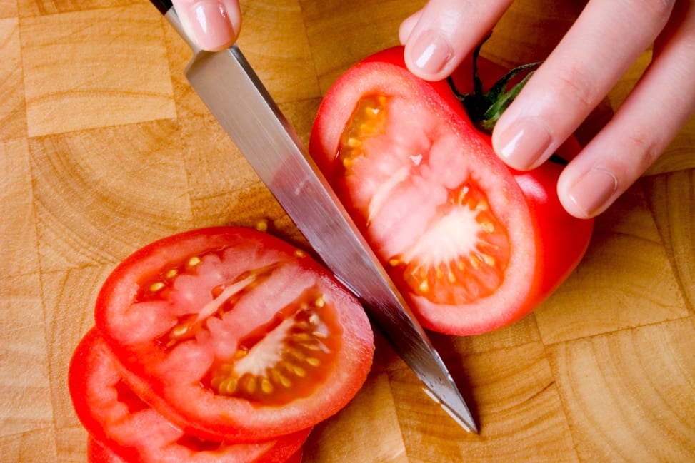 slicing tomatoes for caprese salad and paninis | Classpop Shot 2