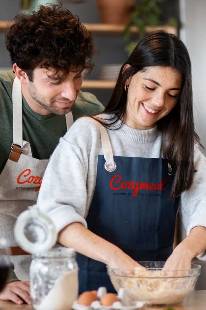 Couple cooking together on a date night class