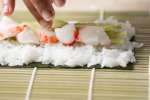 making homemade california roll sushi Shot