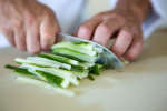 slicing cucumbers for kappa maki sushi Shot