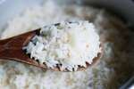 close up of rice on a wooden spoon Shot